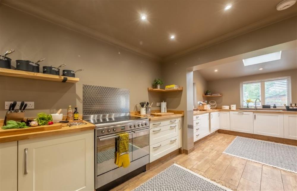 Fully equipped kitchen with an electric range cooker at Gull Cottage, Holme-next-the-Sea