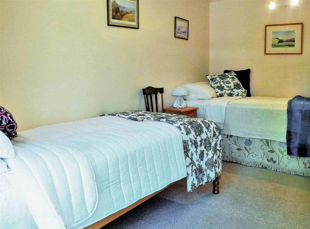 Cosy bedroom with twin beds at Gullieside Cottage in Kirkandrews, near Kirkcudbright, Kirkcudbrightshire