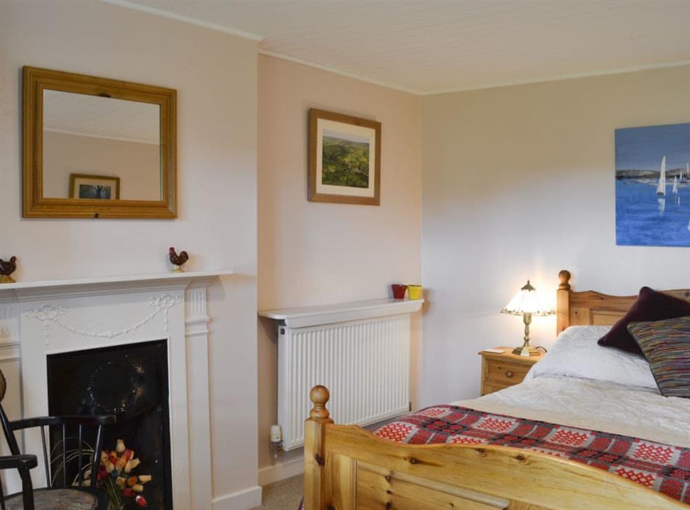 Inviting bedroom with double bed at Gullieside Cottage in Kirkandrews, near Kirkcudbright, Kirkcudbrightshire