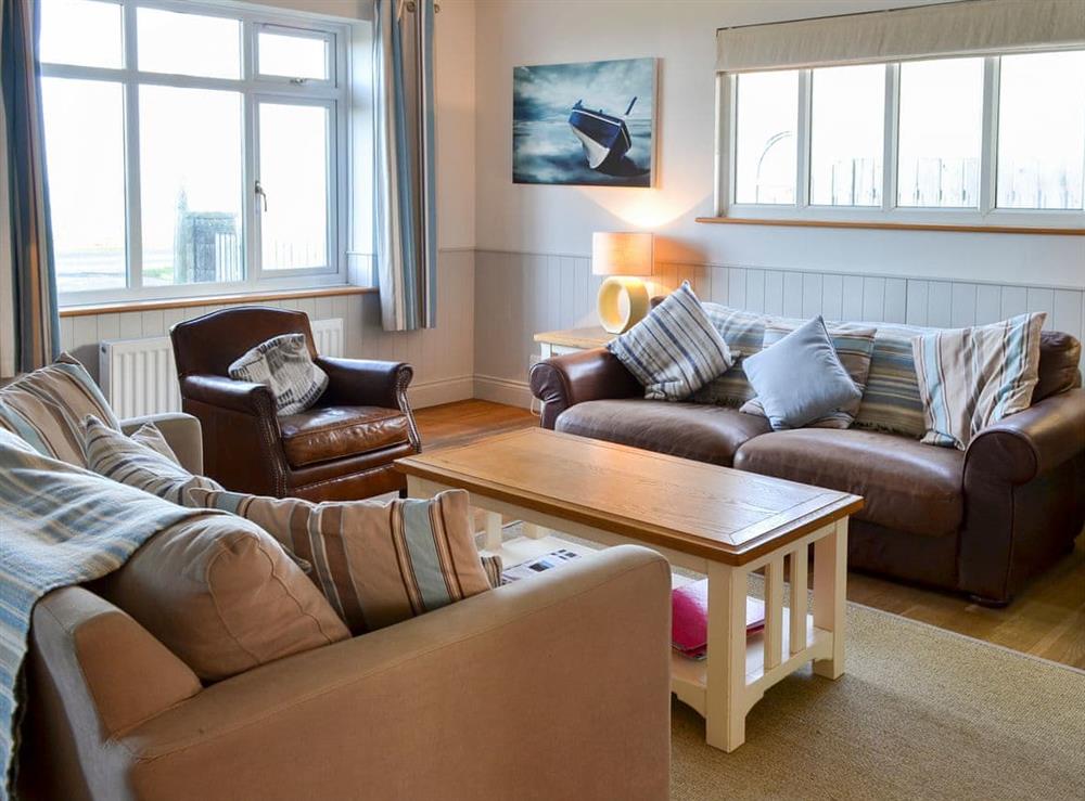 Relaxing living room with cosy wood burner at Gullsway in Beadnell, Northumberland