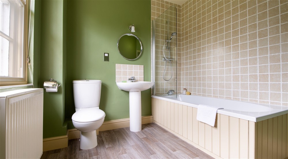 The en-suite bathroom with shower over bath at Gunby Old Rectory in Skegness, Lincolnshire