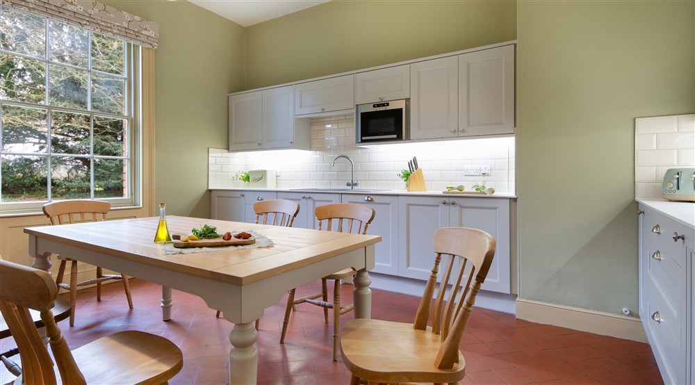 The kitchen with table for six at Gunby Old Rectory in Skegness, Lincolnshire