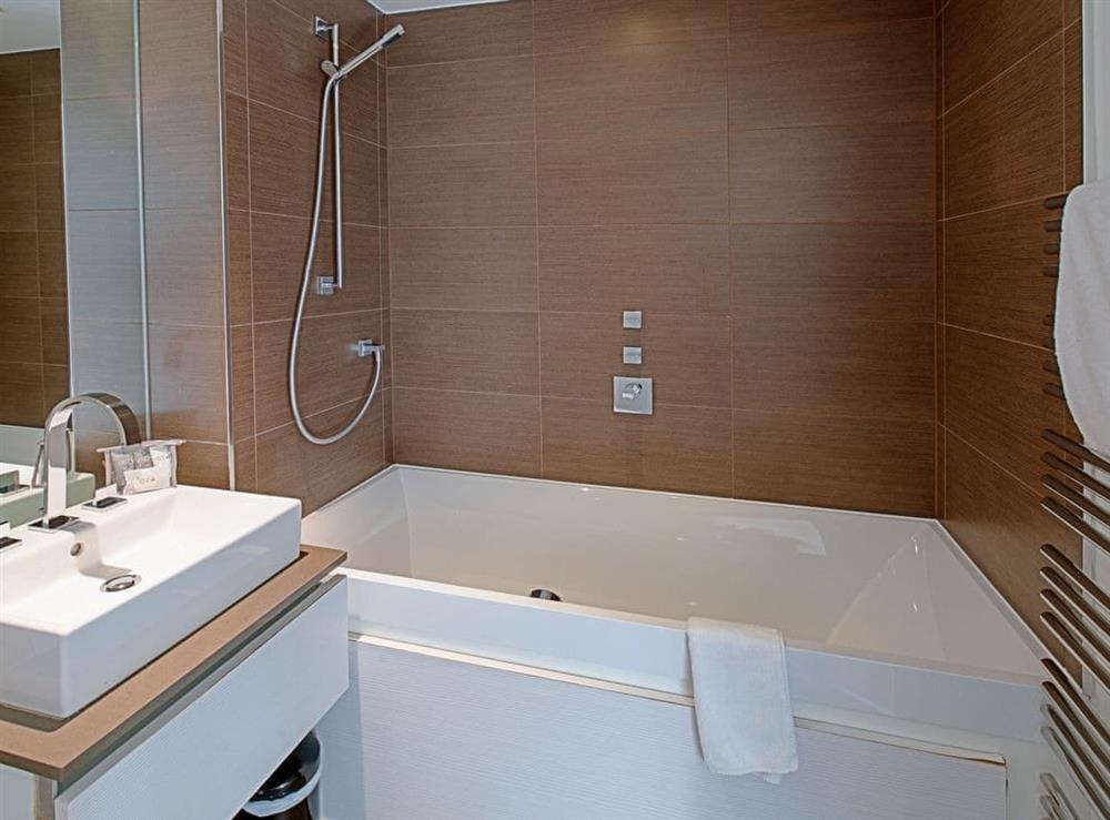 Bathroom with shower over bath at No.1 The Two Bedroom Balcony View A, 