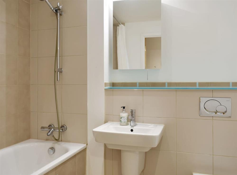 Bathroom with shower over bath at The One Bedroom A, 