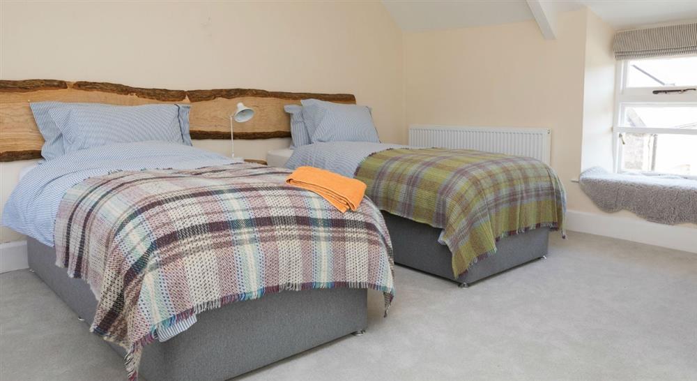 The twin bedroom at Gupton Farm Surf Lodge in Pembroke, Pembrokeshire