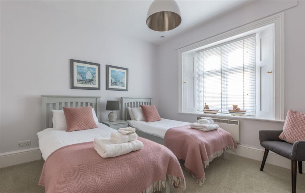 Bedroom with twin 3’ single beds at Gurnard Cottage, St Catherines Lighthouse