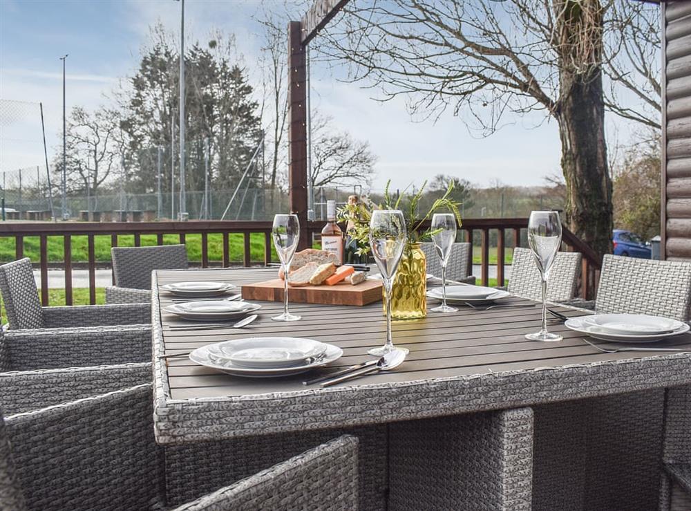 Outdoor eating area at Gurnard Pines in Gurnard, Isle of Wight