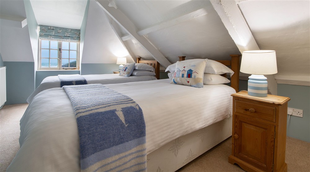 The twin bedroom at Guy's Cottage in Port Quin, Cornwall