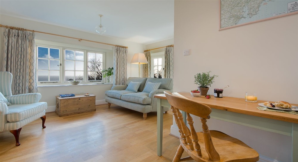 The sitting and dining area at Gwendra Dairy Cottage in Truro, Cornwall