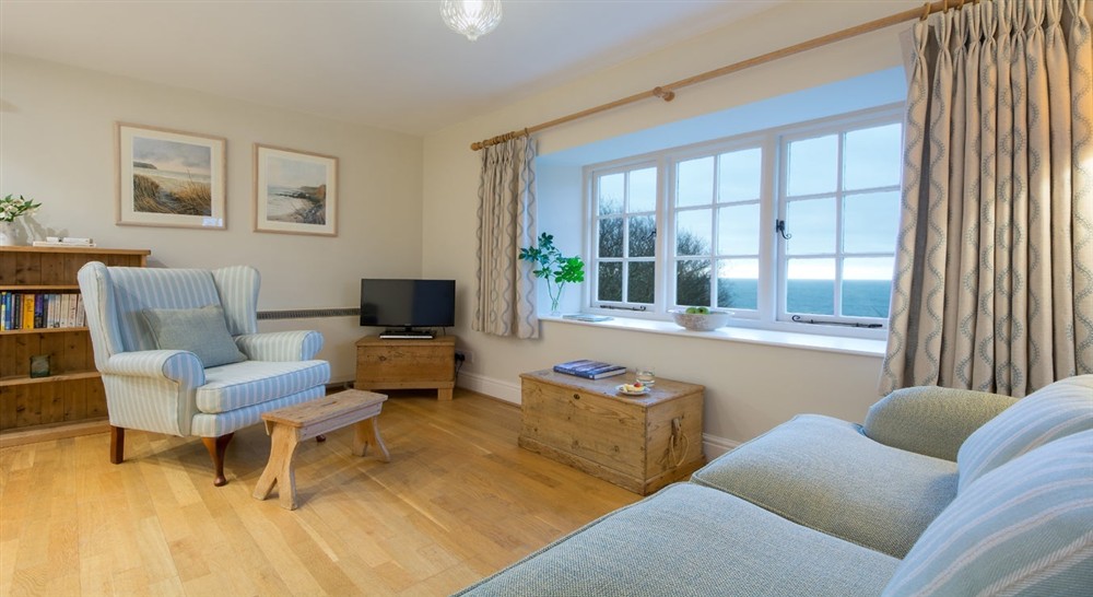The sitting area with coastal views at Gwendra Dairy Cottage in Truro, Cornwall