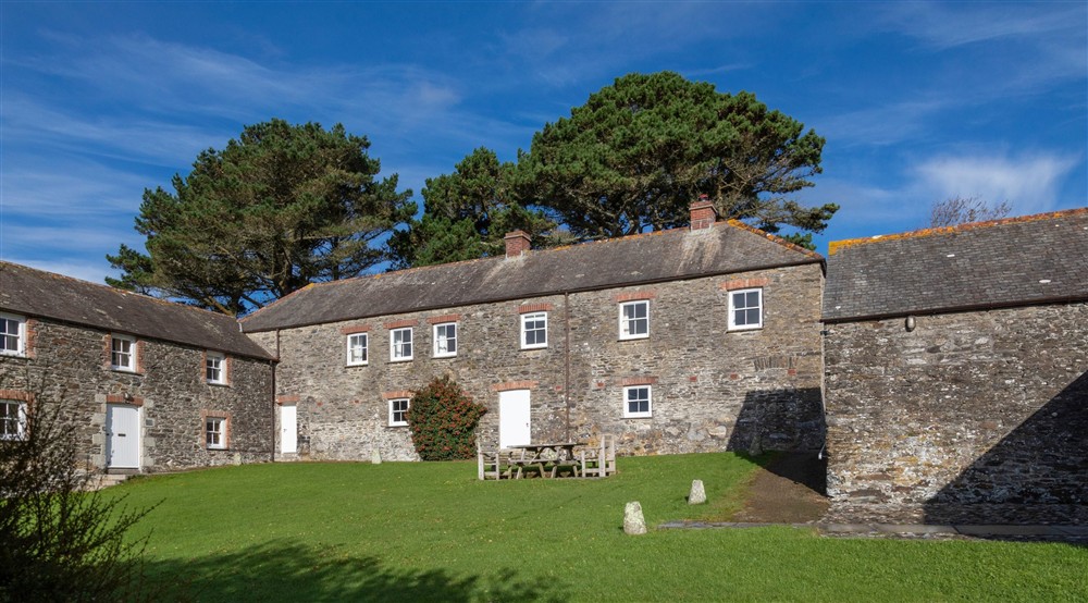 The shared garden with picnic table at Gwendra Granary in Truro, Cornwall