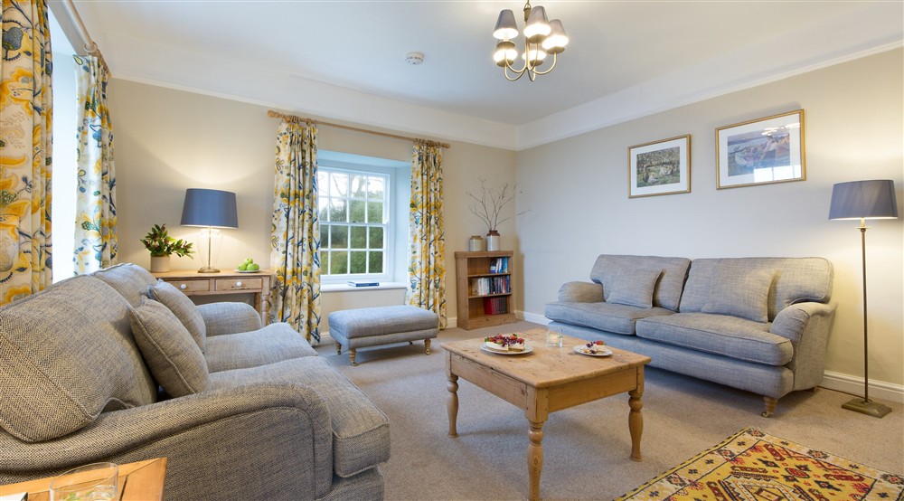 The sitting room has both sea and garden views at Gwendra Wartha in Truro, Cornwall