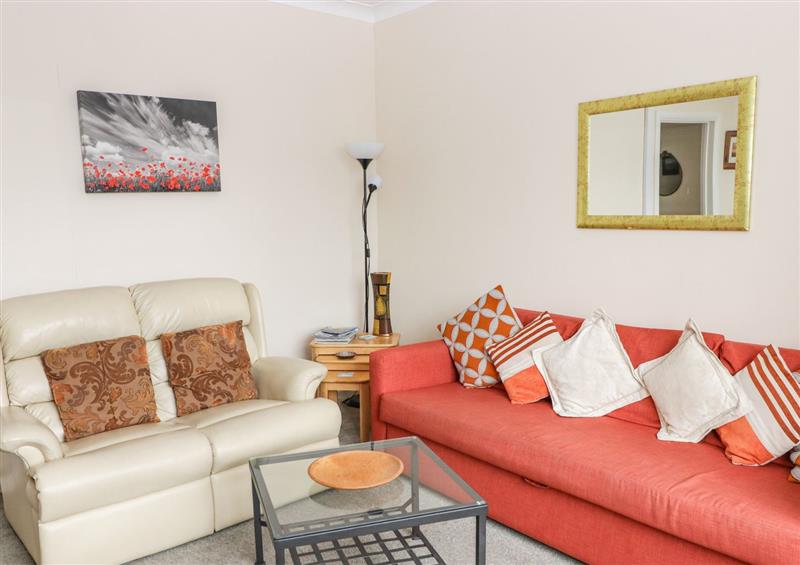 Relax in the living area at Gwylan Apartment, Tenby