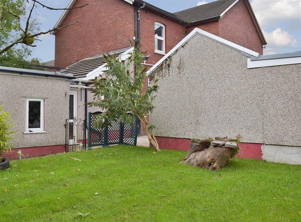 Private lawned garden and garage at Gwylfa in Trimsaran, near Kidwelly, Carmarthenshire, Dyfed