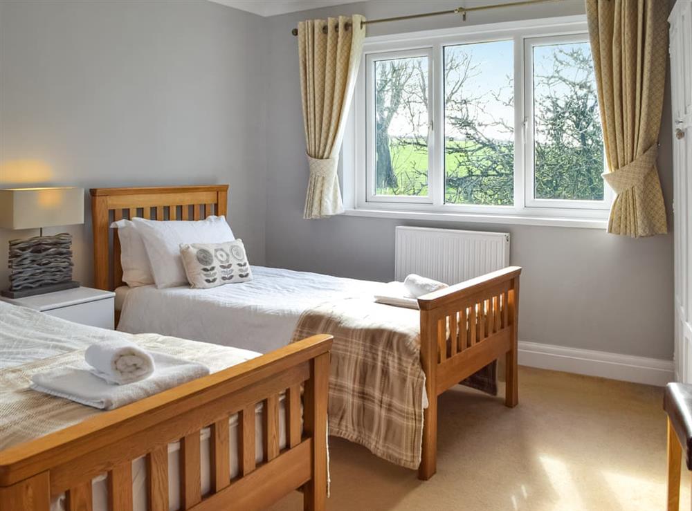 Twin bedroom at Gymmin House in Pendine, Dyfed