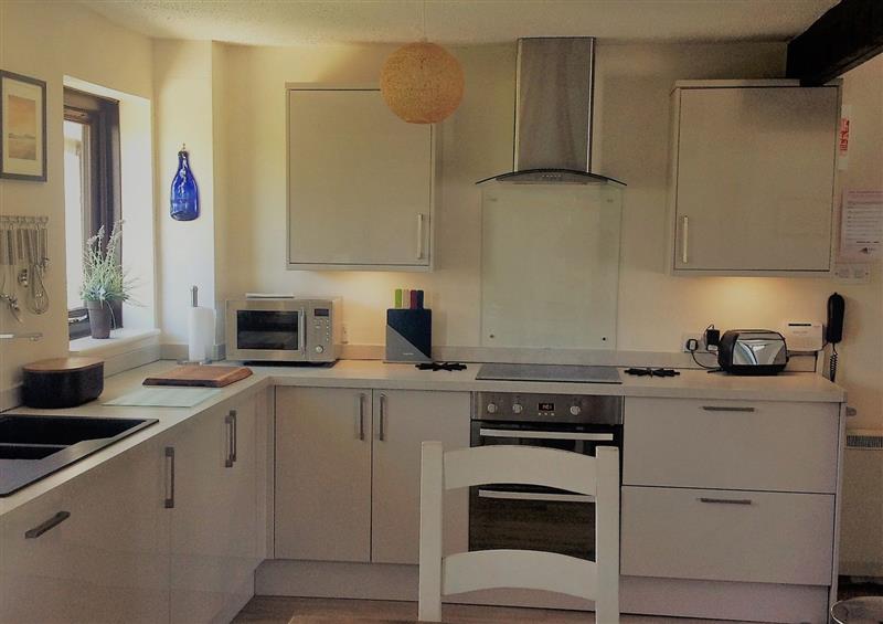 This is the kitchen at Hafan Bach -  233 Cae Du, Abersoch