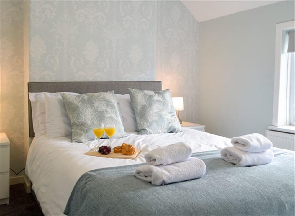Relaxing bedroom with kingsize bed at Hafan in Tenby, Pembrokeshire, Dyfed
