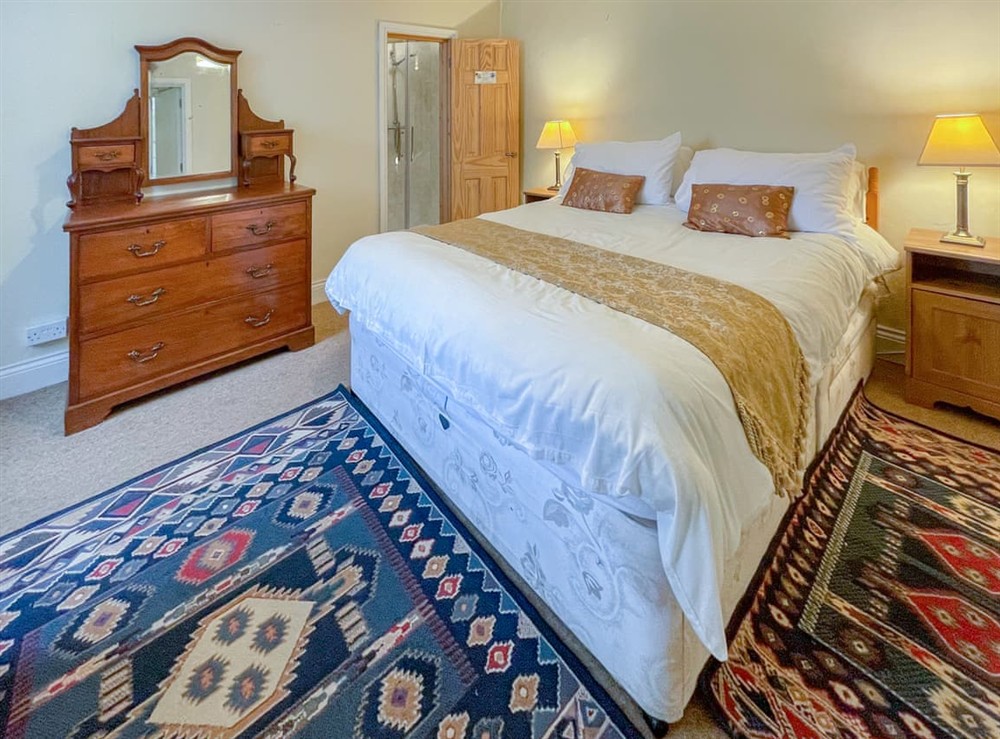 King size family bedroom. Single bed with trundle on request. <br />Ensuite with full height shower cubicle, toilet and wash hand basin at Hafod Fach in Moylegrove, near Preseli Hills, Dyfed