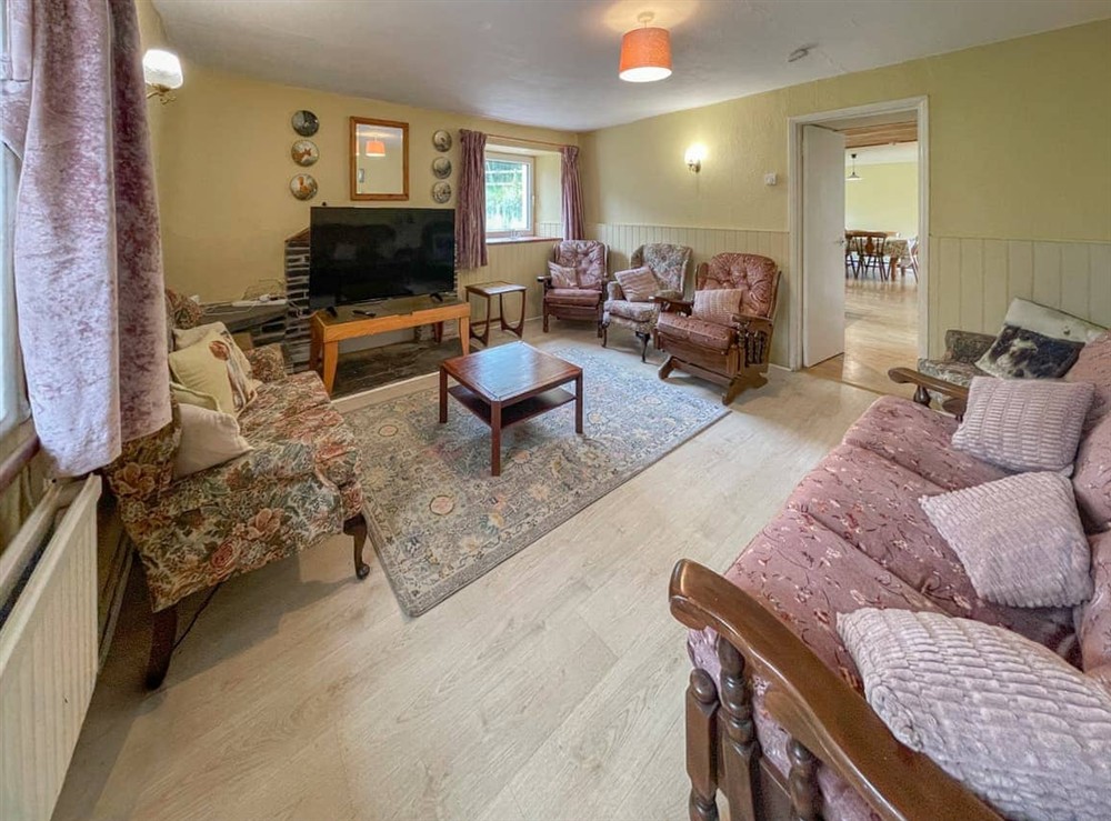 Large family Sitting Room.  Large smart TV, very comfortable seating with rocking chair! at Hafod Fach in Moylegrove, near Preseli Hills, Dyfed