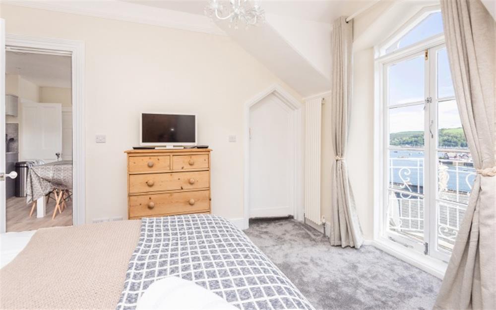 Bedroom four with french doors leading out to a small balcony outstanding with river views at Halcyon House in Dartmouth