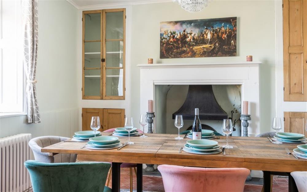 Elegant separate dining room with feature fireplace. at Halcyon House in Dartmouth