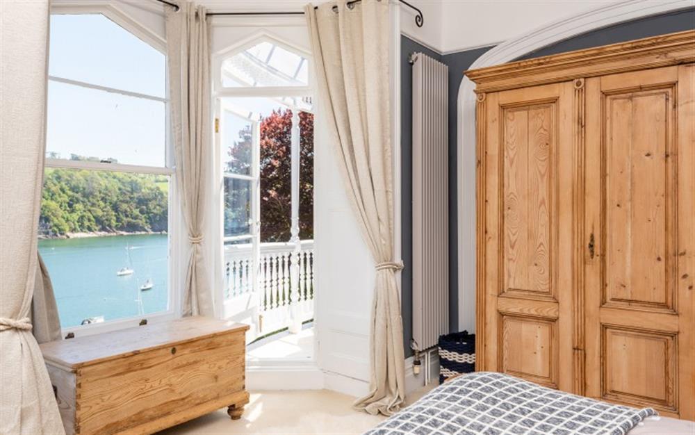 Large bay window in the master bedroom with excellent river views. at Halcyon House in Dartmouth