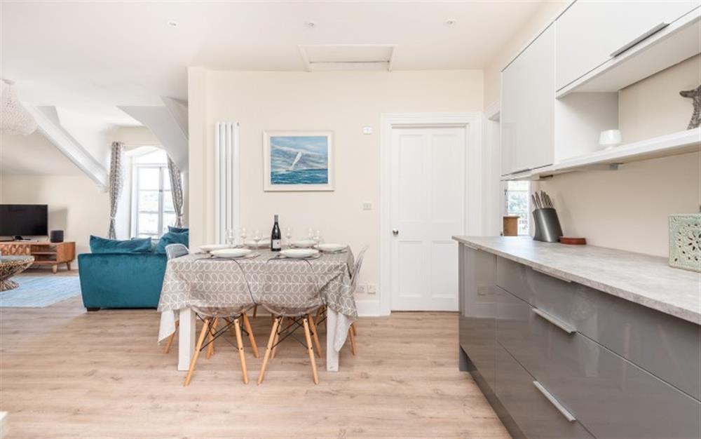 Top floor's open plan kitchen, dining space and living area. at Halcyon House in Dartmouth