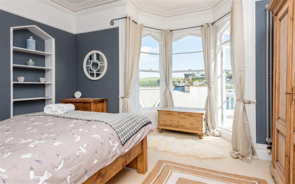 Well-presented master bedroom with large bay windows and river views. at Halcyon House in Dartmouth