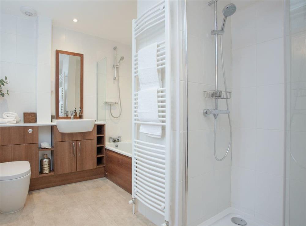 Family bathroom with bath and large shower at Haldon View in Lympstone, Devon