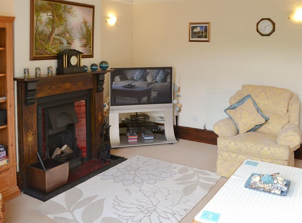 Comfortable living room at Half Moon Cottage in Great Yarmouth, Norfolk