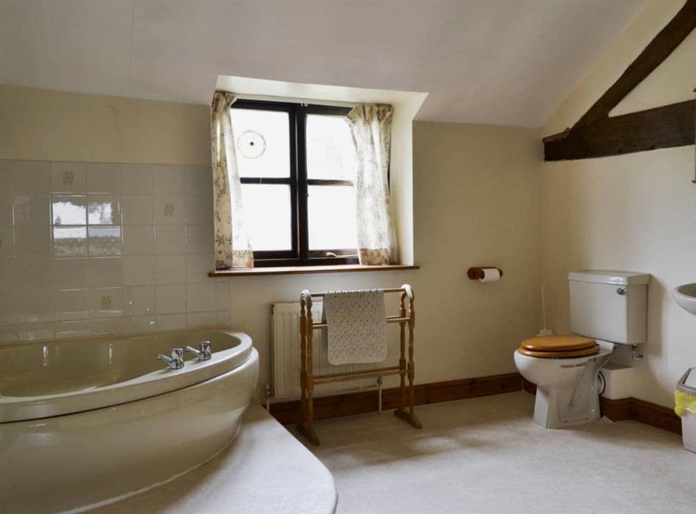 Large bathroom with corner bath and seperate shower at Halford Big Barn in Craven Arms, Shropshire