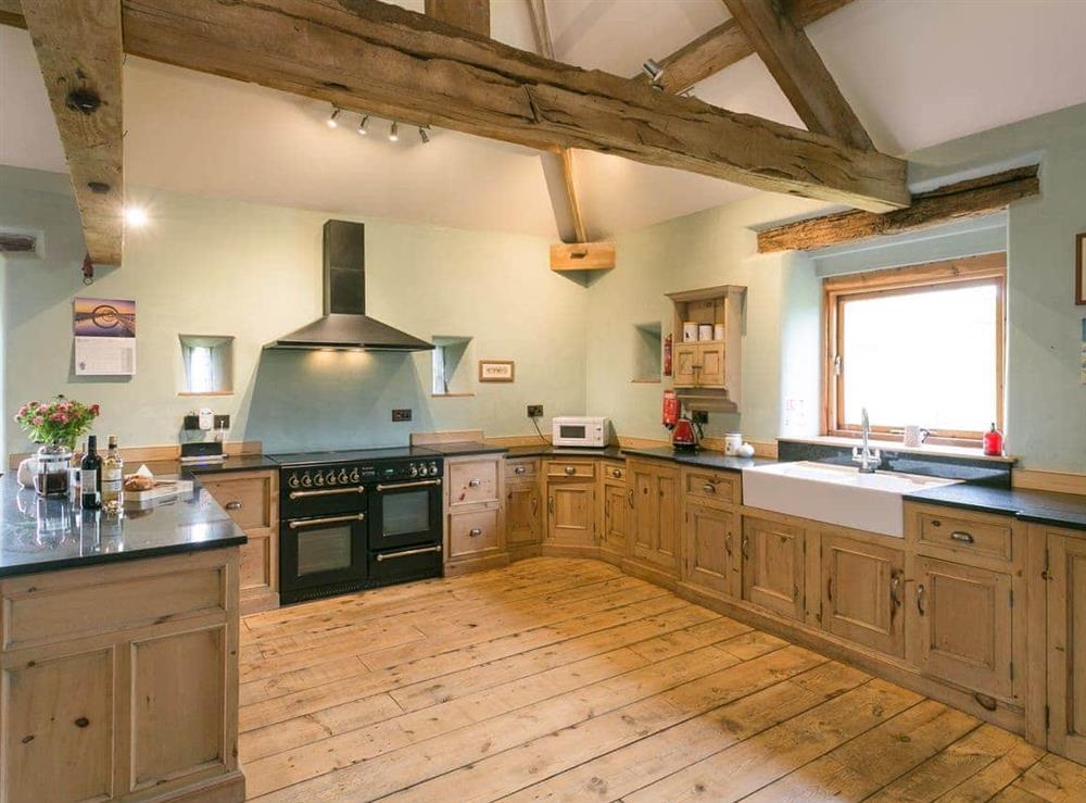 Kitchen with range cooker & oak flooring at Hall Barn in Earl Sterndale, near Buxton, Derbyshire