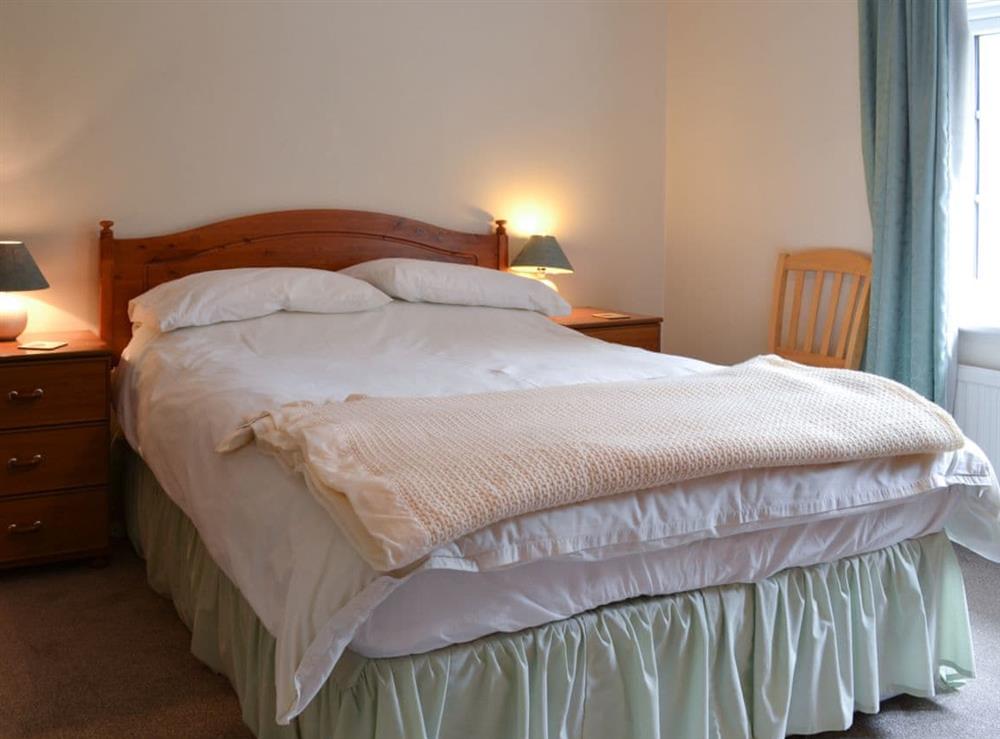 Inviting double bedroom with king size bed at Hall Cottage in Gresham, near Sheringham, Norfolk