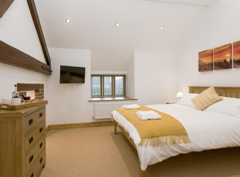 Comfortable double bedroom at The Great South Barn, 