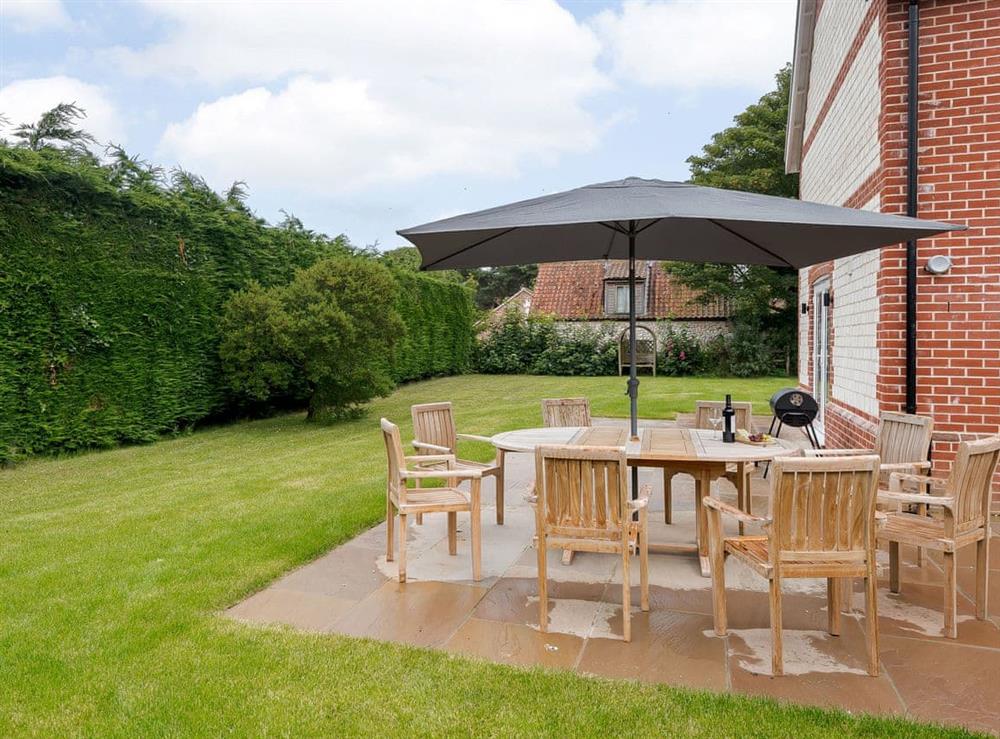 Sun deck with garden furniture at Sea Holly Cottage, 