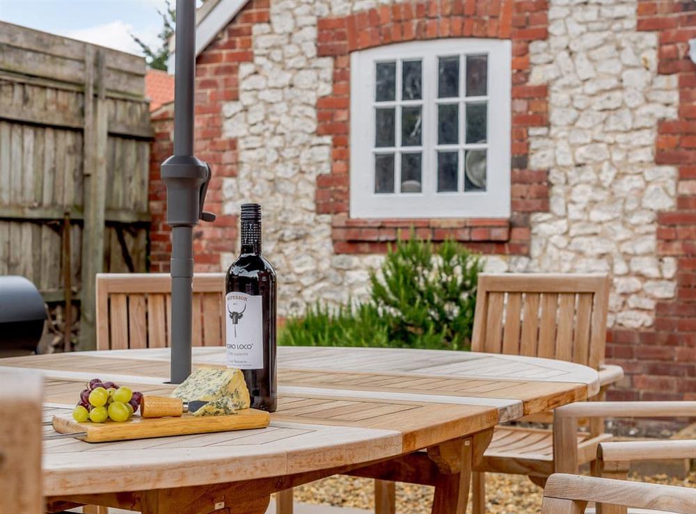 Enclosed courtyard with sun deck, garden furniture and BBQ (photo 3) at Sea Lavender Cottage, 