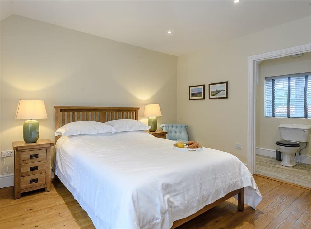 Relaxing bedroom with kingsize bed and en-suite (photo 3) at Sea Lavender Cottage, 