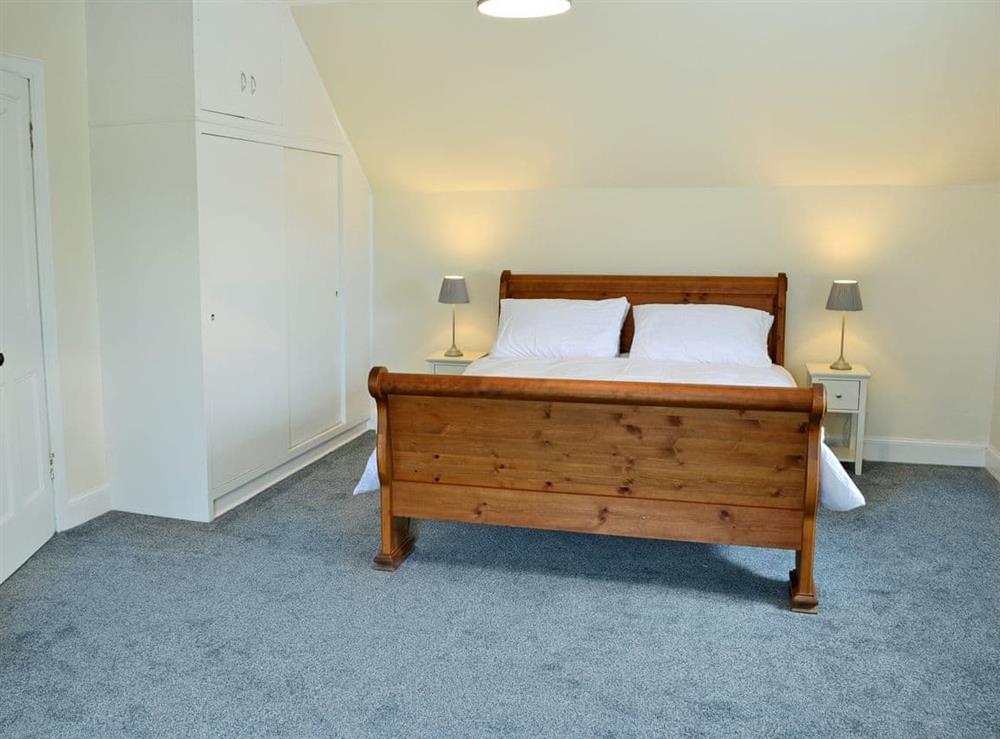 Relaxing double bedroom with sleigh bed at Halleaths Home Farm in Lochmaben, Dumfries and Galloway, Dumfriesshire