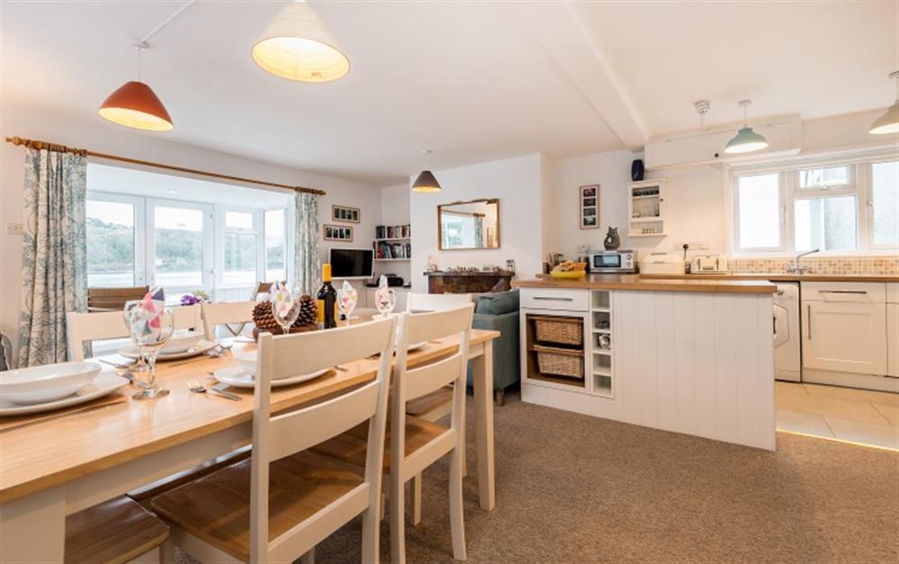 There is plenty of room for six round the large dining table.   at Halliards in Helford Passage