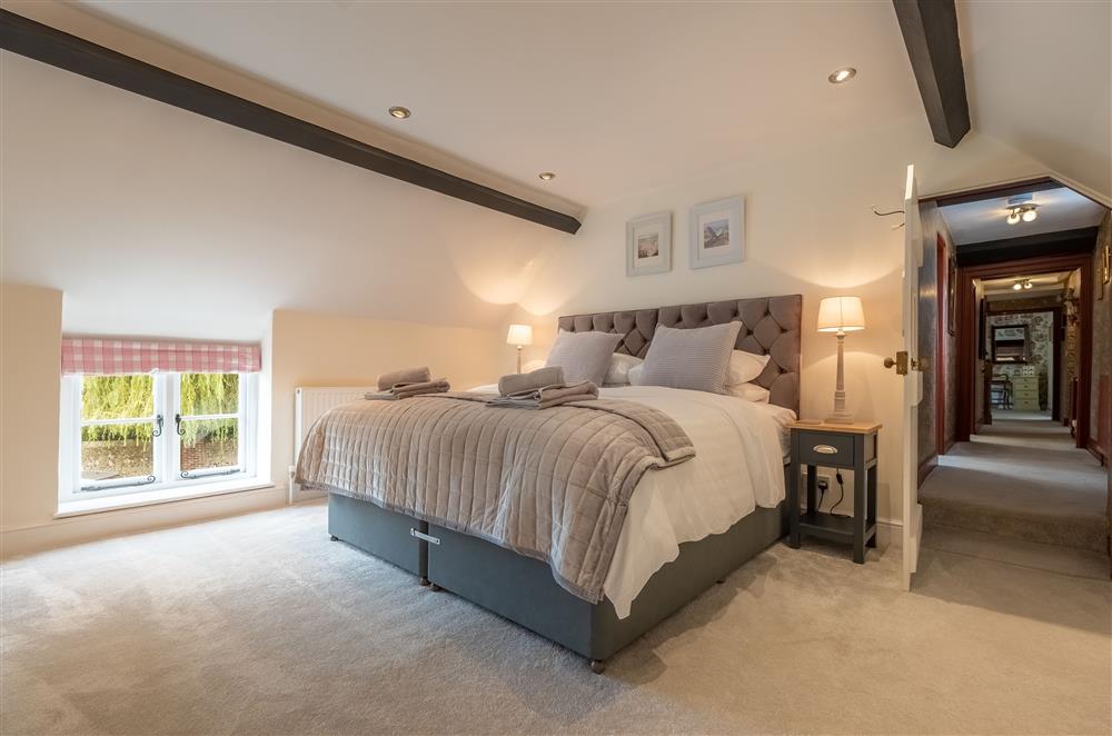 First floor: Bedroom four with a super-king size bed and Smart television at Ham Farm, Sydling St Nicholas