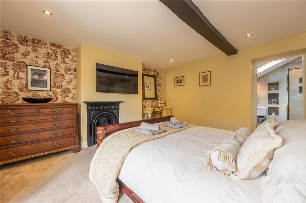 First floor: Bedroom two with a king-size bed and en-suite shower room  (photo 2) at Ham Farm, Sydling St Nicholas