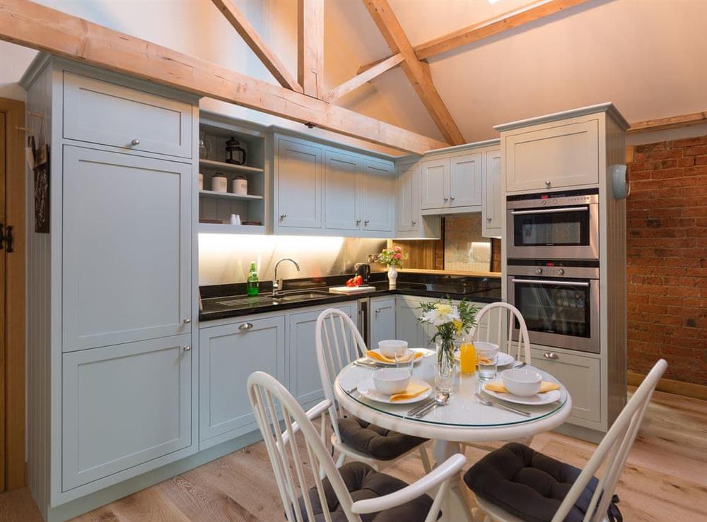Kitchen & dining area at Daisy Cottage, 