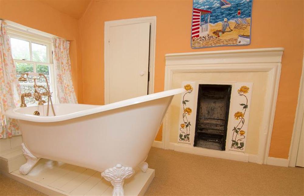First floor:  Jack and Jill bathroom with decorative fire surround at Hambledon, Cley-next-the-Sea near Holt