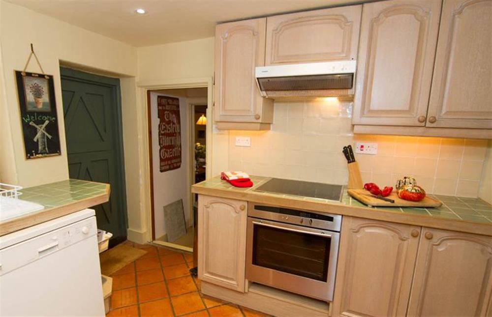 Ground floor:  Kitchen with electric oven induction hob and extractor fan at Hambledon, Cley-next-the-Sea near Holt