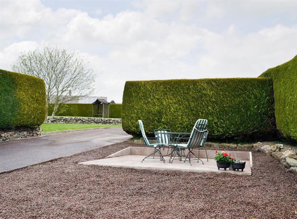 Paved patio with outdoor furniture at Hameish Holiday Cottage in Kirkcudbright, Dumfries & Galloway, Kirkcudbrightshire