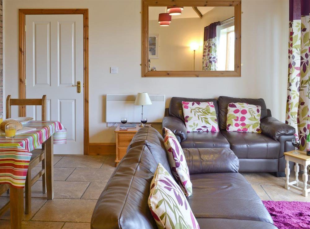 Light and airy open-plan living room, dining room and kitchen at Hampshire Cottage in Muston, Filey, North Yorkshire