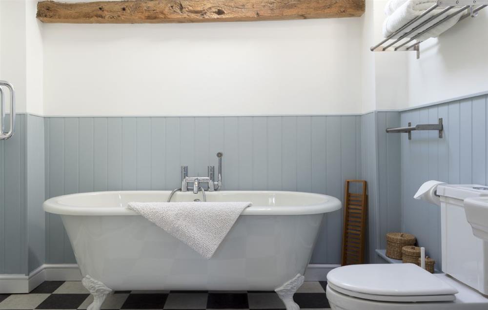 Bathroom with roll top bath and separate shower at Hampton Wafre Cottage, Docklow