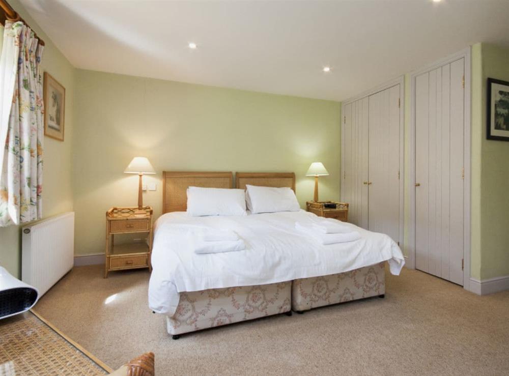 Calming bedroom with en-suite bathroom at Hanger Mill Barn in Salcombe, Devon