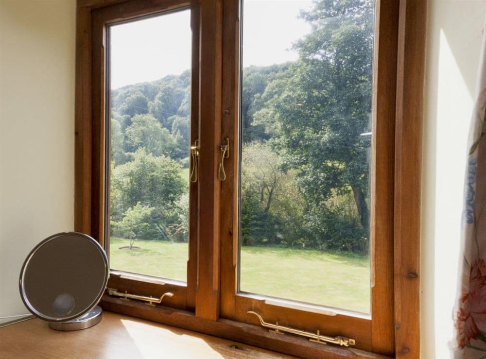 Fantastic views of the valley from the bedroom at Hanger Mill Barn in Salcombe, Devon