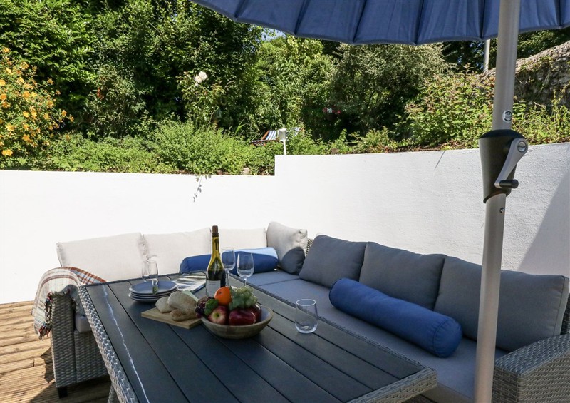 Enjoy a cup of tea on the patio at Happiness Cottage, Piddlehinton